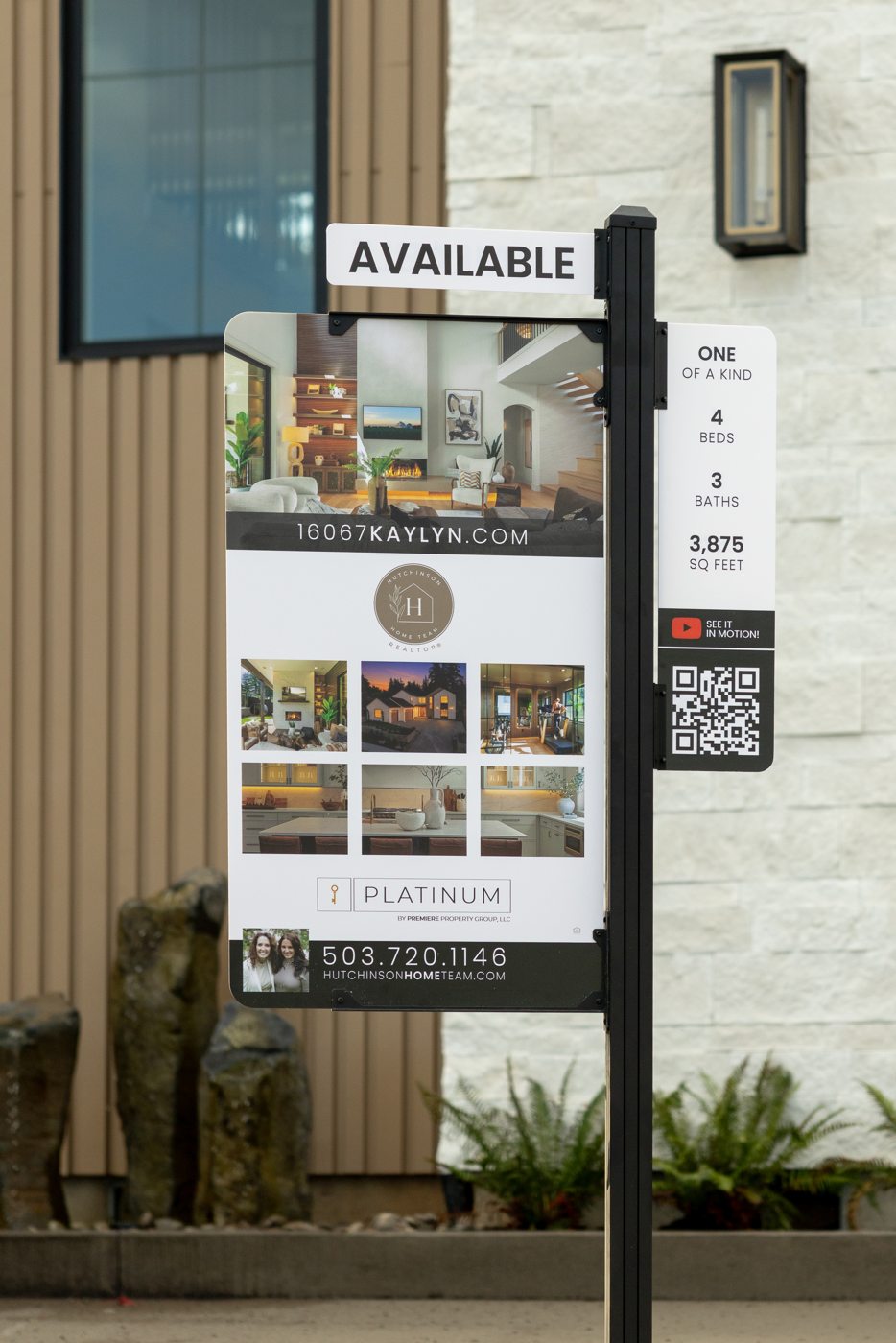 Platinum Spire sign featuring property photography, listing details, and a QR code outside a home